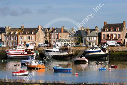 Fishing boats in the harbor at the village of Barfleur in the region of Basse-Normandie, France.