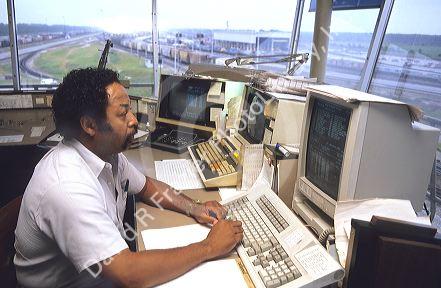 Train dispatcher at work in tower near Waycross, Georgia.