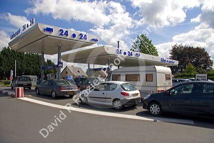 Automobiles lined up at a gas station in Bayeux in the region of Basse-Normandie, Normandy, France.