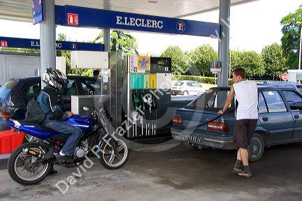 Automobiles fueling up at a gas station in Bayeux in the region of Basse-Normandie, Normandy, France.