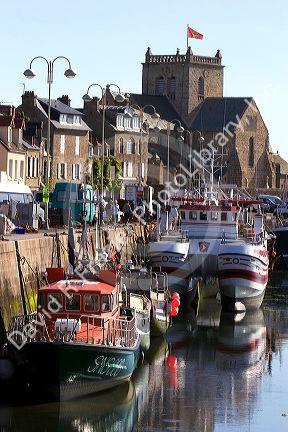 Fishing boats docked in the harbor at the village of Barfleur in the region of Basse-Normandie, France.