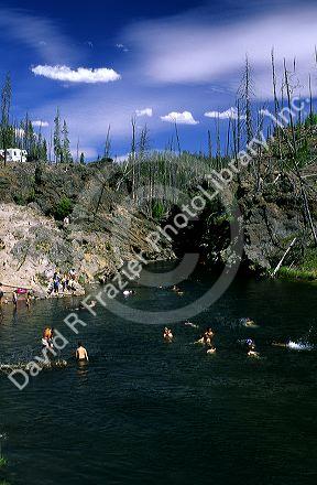 People swimming in Fire Hole River at Yellowstone National Park, Wyoming.