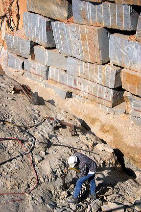 Worker drilling in a granite quarry in Elberton, Georgia.