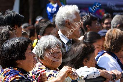 A crowd of Mexican people celebrating the Day of the Dead in the Zocalo in Mexico City, Mexico.