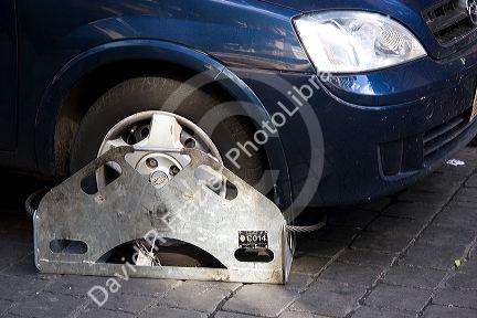 Wheel clamp used instead of towing an illegally parked car in Mexico City, Mexico.