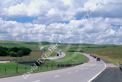 Automobiles travel on Interstate 90 through South Dakota.
