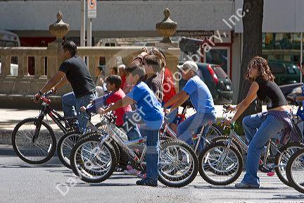 Mexican youth riding bicycles in Mexico City, Mexico.