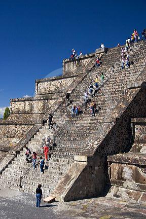 Tourists climb the steps of the Pyramid of the Moon at Teotihuacan in the State of Mexico, Mexico.