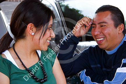 Mexican teens talking in the plaza at Taxco in the State of Guerrero, Mexico.