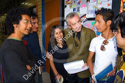 Professor speaking with students on the campus of the National Autonomous University of Mexico in Mexico City, Mexico.