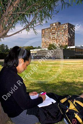Female student studying near the Central Library on the campus of the National Autonomous University of Mexico in Mexico City, Mexico. MR