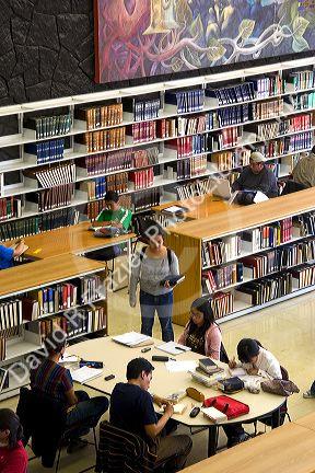 Students study in the Central Library at the National Autonomous University of Mexico in Mexico City, Mexico.
