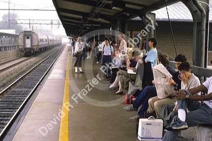 New Jersey commuters wait on platform for a train.