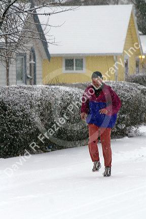 Man jogging in the snow in Boise, Idaho.