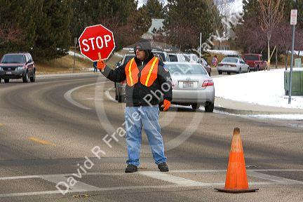 School crossing guard in the winter snow in Boise, Idaho.