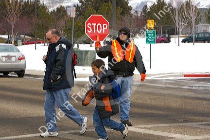 School crossing guard in the winter snow in Boise, Idaho.