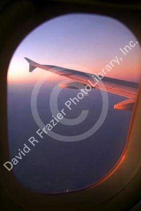 Aerial view of the Andes in Argentina at sunrise through the window of an airplane.