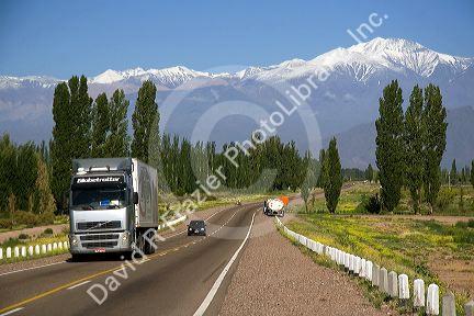 A view of the Andes Mountain Range with traffic on highway 7 near Mendoza, Argentina.