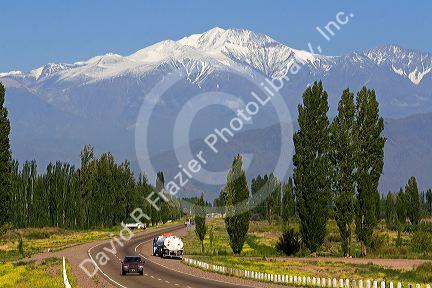 A view of the Andes Mountain Range with traffic on highway 7 near Mendoza, Argentina.