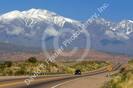 A view of the Andes Mountain Range with traffic on highway 7 near Mendoza, Argentina.