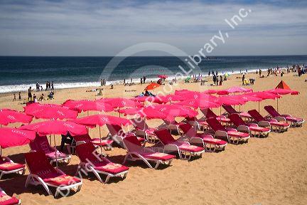 Umbrellas and beach chairs on the beach at Renaca on the Pacific Ocean in Chile.
