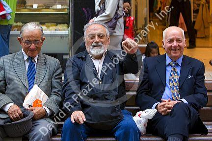 Elderly Chilean men sit on a bench together in Santiago, Chile.