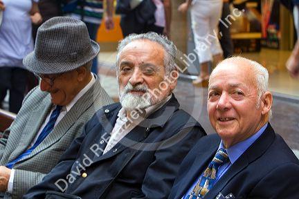 Elderly Chilean men sit on a bench together in Santiago, Chile.