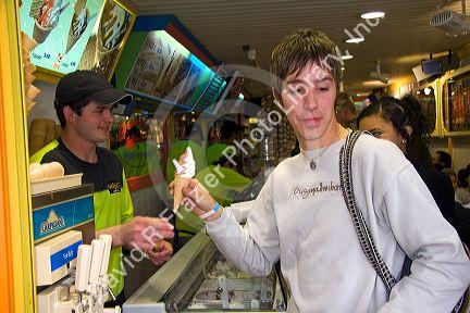 Teenage boy in an ice cream shop at Ushuaia on the island of Tierra del Fuego, Argentina.
