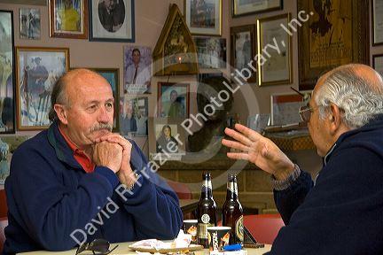 Argentine men socialize in the Panaderia Union bakery at Tolhuin, Tierra del Fuego, Argentina.