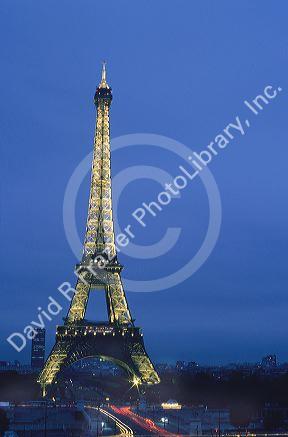 The Eiffel Tower lit up at night in Paris, France.