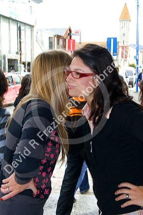 Friends greet each other at Ushuaia on the island of Tierra del Fuego, Argentina.