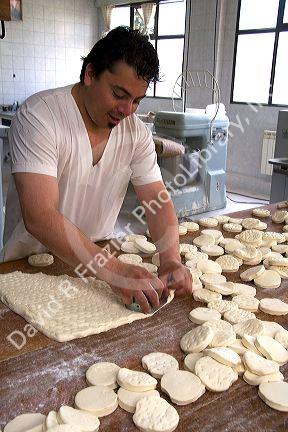 Baker making biscuits at the Panaderia Union in Tolhuin, Tierra del Fuego, Argentina.