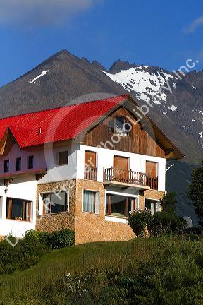 Chalet style house below the Martial mountain range at Ushuaia, Tierra del Fuego, Argentina.