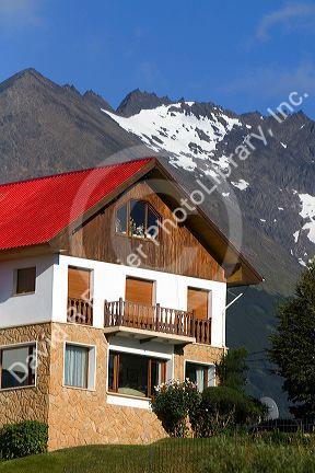 Chalet style house below the Martial mountain range at Ushuaia, Tierra del Fuego, Argentina.