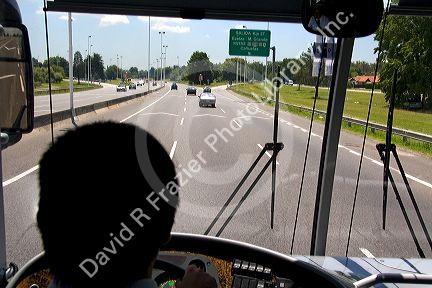 View over the shoulder of a bus driver in Buenos Aires, Argentina.