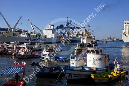 Container ships and other small boats in the Port at Valparaiso, Chile.