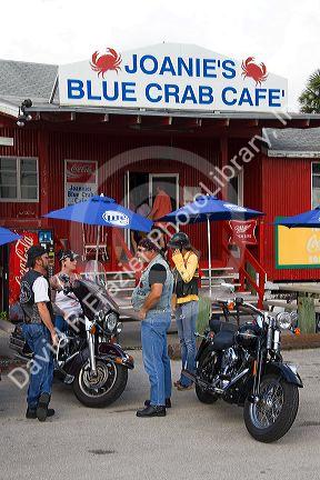 Bikers in front of Joanie's Blue Crab Cafe along Tamiami Trail on U.S. Highway 41 in the Florida Everglades.