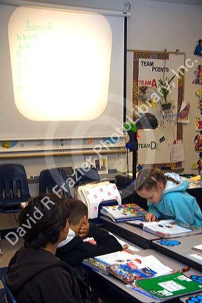 Students read textbooks in a fourth grade classroom in Tampa, Florida.
