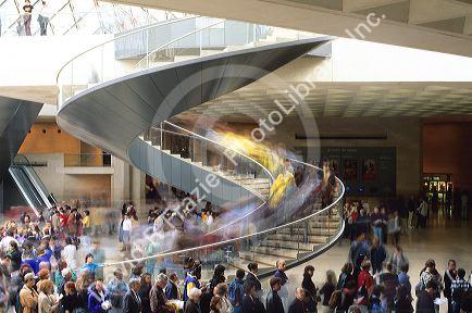 The movement of people entering the Louvre in Paris, France.