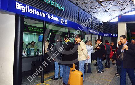 Passengers purchase train tickets at Roma Termini, Rome's central station, Italy.