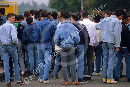 Italians teens wearing denim jeans and jackets at Verona, Italy.