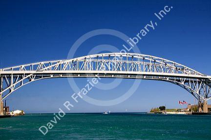 The Blue Water Bridge is a twin-span bridge that spans the St. Clair River between Port Huron, Michigan and Point Edward, Ontario.