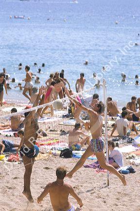 People playing volleyball on the beach on the French Riviera.