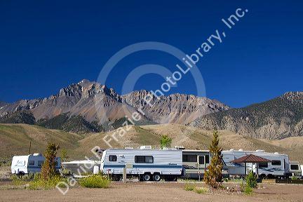 RV camping at the Joe T. Fallini BLM campground below the mountain peaks of the Lost River Range in central Idaho at Mackay Reservoir.