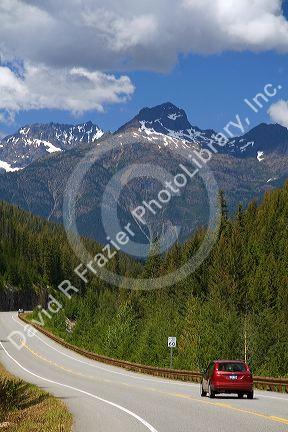 Automobile traveling on Washington State Highway 20 in the North Cascade Range, Washington.