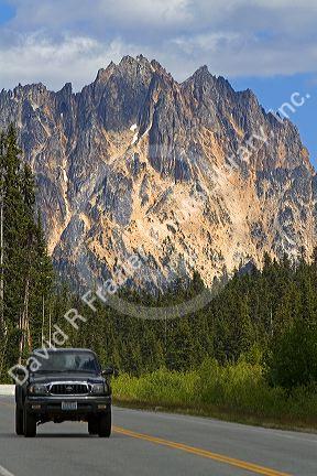 Pickup truck traveling on Washington State Highway 20 in the North Cascade Range, Washington.