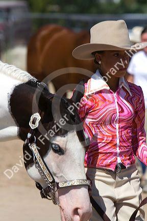 Girl showing her Pinto horse to 4-H judges at the Western Idaho Fair in Boise, Idaho.