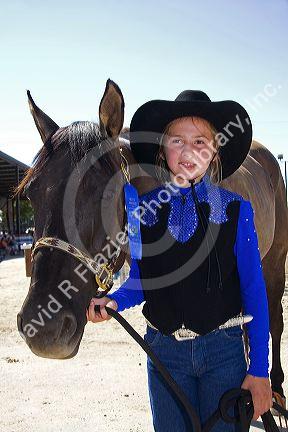 Girl with her 4-H blue ribbon winning horse at the Western Idaho Fair in Boise, Idaho.
