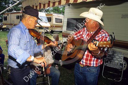 Musicians play fiddle and guitar at the National Oldtime Fiddlers Contest in Weiser, Idaho.