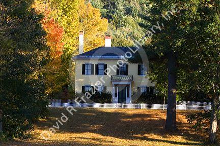 Residential home and fall foliage in the town of Orford, New Hampshire, USA.